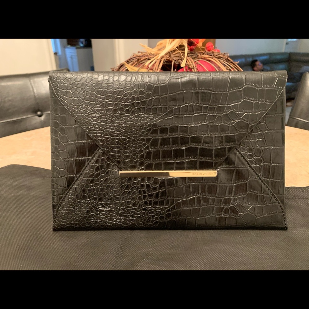 BCBG CLUTCH. NEW!never used.  Moving sale